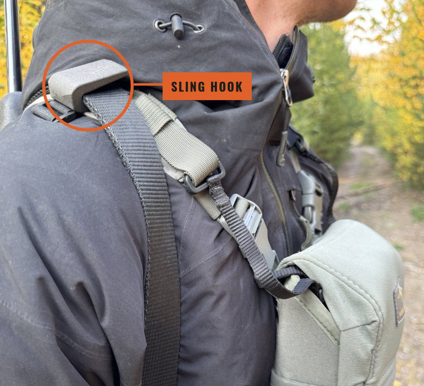 Sling Hook holding a rifle sling on a binocular harness shoulder strap